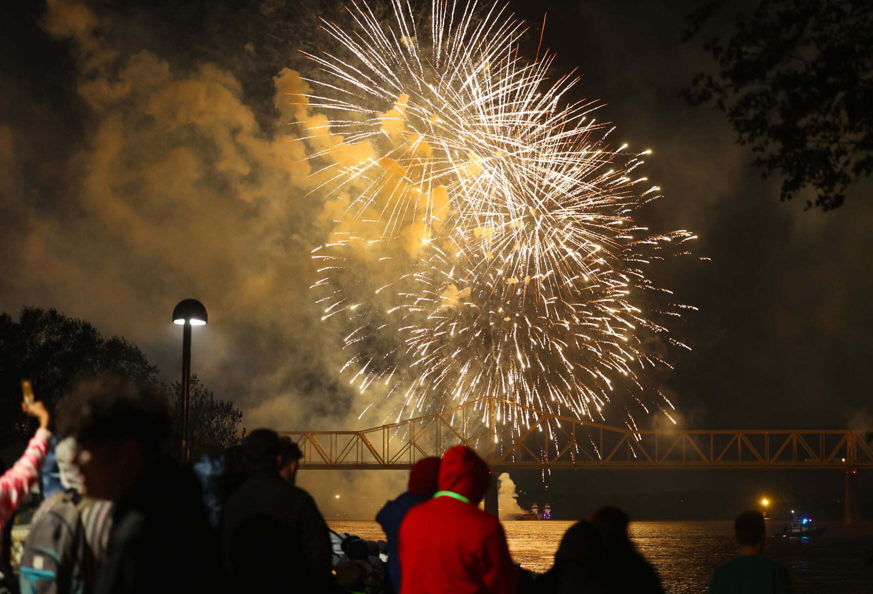 Thunder fireworks in the sky with people watching.JPG